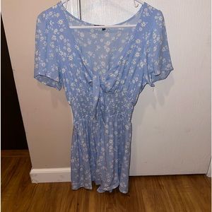 Blue romper with white flowers. Size: M, still has tag on it, not worn.